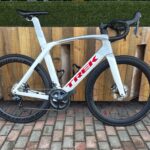 Pre-owned Trek Madone SL 7 58cm in white with red Trek logo, side view